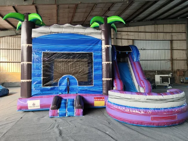Tropical Jumping Castle with Slide available for hire from Sydney Prime Bounce